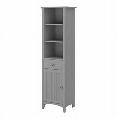 a tall gray cabinet with drawers and doors