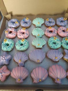 a box filled with donuts covered in frosting