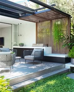 an outdoor living area with furniture and plants