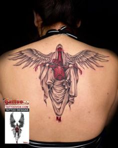 the back of a woman's shoulder with an angel tattoo on it