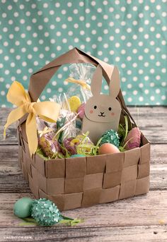 a basket filled with chocolate eggs and an easter bunny