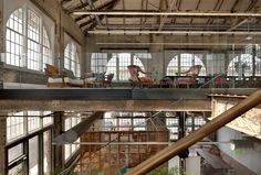 an industrial building with lots of windows and metal railings