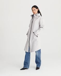 WAVE has a feminine, urban feel and is perfectly versatile. This coat adds a contemporary touch to the wardrobe. DESCRIPTIONA tailored cape extends from the arm over the shoulders and back.The coat closes with a 2-way bonded waterproof zip.Two big waterproof pockets on the front panels close with waterproof zips.The hood closes with a drawstring offering maximum protection and visibility.All the seams are thermal-bonded against the rain.A small split in the centre back gives extra leg movement.M Modern Cape Outerwear For Work, Modern Cape-style Workwear Outerwear, Modern Workwear Cape Outerwear, Modern Long Coat, Leg Movement, Hooded Raincoat, 2 Way, High End Fashion, The Rain