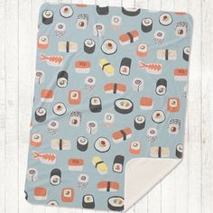 a blue blanket with sushi on it