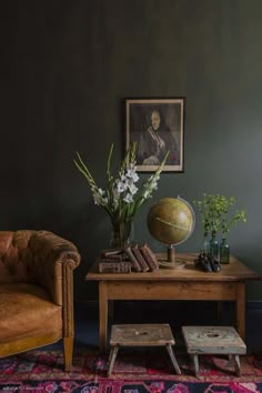 a living room filled with furniture and a globe on top of a wooden coffee table