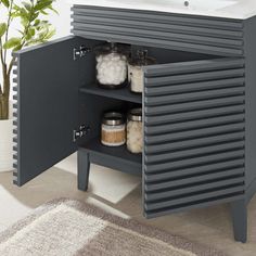 a bathroom vanity with an open door and drawers