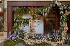 an outdoor display with flowers and greenery