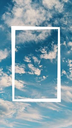 a white square frame in the middle of a blue sky with some clouds behind it