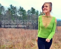 a woman standing in a field wearing a green sweater and black pants with the words project written above her