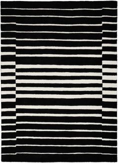 a black and white rug with vertical stripes