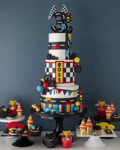 a multi - tiered cake is decorated with legos