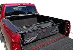 the back end of a red truck with its cargo bag in it's bed