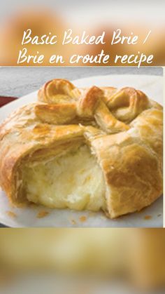 a piece of bread on a plate with the words basic baked brie / brie en croute recipe