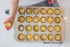 a muffin tin filled with some kind of food