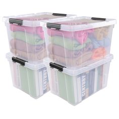 three plastic storage containers filled with clothes