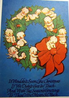 an old fashioned christmas card with pigs and holly wreath on the front, says it wouldn't seem like christmas if we didn't get in touch and wish the season greetings