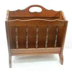 an old fashioned wooden toy crib with handles