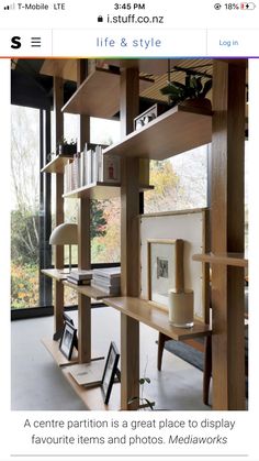 a room with bookshelves and pictures on the shelves