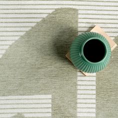 a cup of coffee sitting on top of a table