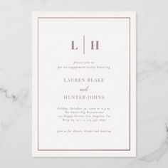 a white and pink wedding card with the letter h on it's front side