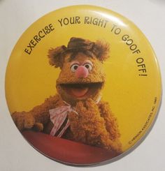 a button with the words exercise your right to go out of it and an image of miss piggy