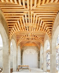 an unfinished room with benches and scaffolding on the ceiling is seen in this image