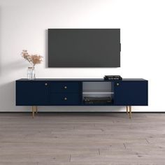 an entertainment center with a television mounted on the wall