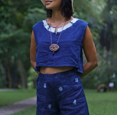 "Blue Indigo Tie Dye Sleeveless Top for Women 100% Double gauze cotton. Indigo natural dye with tie-dye detail on the side. Sizing: Made in one size to fits XS to M / US: 2/4/6/8 Measurement; Chest up to 37'' Pit to pit across 19'' Length top to bottom 15\" Armhole 18'' around. **Model is a size US 6 with 33\"bust 36\" hip. 164 cm tall.** Description: 100% Double Gauze cotton. Very soft and comfy. Indigo natural dye. With tie-dye detail on the sides. Simple round neck with a small slid in the mi Sleeveless Cotton Tops With Natural Dye, Sleeveless Cotton Top With Natural Dye, Blue Cotton Sleeveless Tank Top, Indigo Sleeveless Top For Spring, Blue Cotton Sleeveless Top, Sleeveless Indigo Tops For Spring, Casual Sleeveless Top With Natural Dye, Casual Sleeveless Eco-friendly Top, Blue Tops With Natural Dye