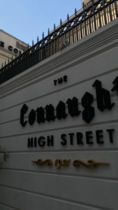 the sign on the side of a building that says, the campaign high street in gold lettering