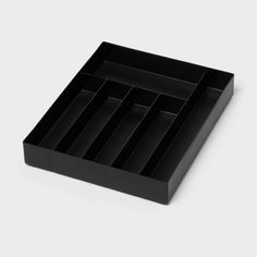 a black tray with six compartments on it