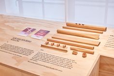 a wooden table with several pieces of wood on it and instructions to make them look like they are working together