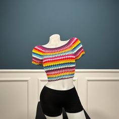 Crochet Crop Top is the perfect choice for summer days, when you want to feel comfortable and stylish. A trendy crochet is sure to be a hit with fashionistas everywhere. Make a statement with the retro-inspired crochet vest top, featuring a bright color combination. Please let us know if you would like specific bust, waist and hip measurements. Machine washable at low temperatures. Machine wash gentle (40 C/104 F) Trendy Multicolor Short Sleeve Knit Top, Trendy Fitted Tops With Crochet Lace, Crochet Crop Top For Beach, Crochet Crop Top For The Beach, Trendy Fitted Top With Crochet Lace, Knit Tops For Summer Beachwear, Multicolor Short Sleeve Crop Top For Summer, Knit Crochet Trim Crop Top For Beach, Trendy Knit Tops For The Beach