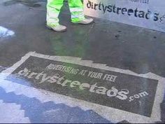 a man standing on the side of a road next to a sign that says streetbos