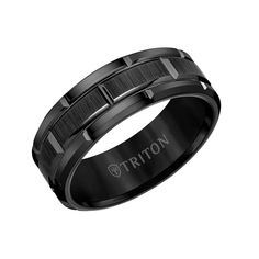 a black ceramic ring with the word triton engraved on it's center and sides