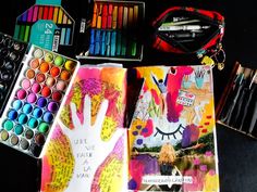 an assortment of art supplies including watercolors, markers and pencils on a table