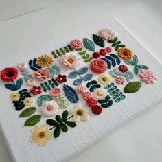 a close up of a piece of cloth with flowers on it