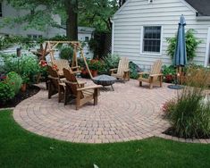 a patio with chairs and an umbrella in the middle