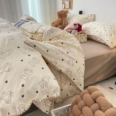 a bed with teddy bears on it in a bedroom