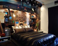 an airplane themed bedroom is shown in black and white colors, with lots of lights on the ceiling