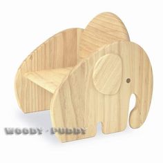 an elephant shaped wooden toy sitting on top of a white background with the words woody puppy