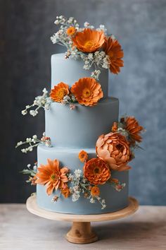 Demin blue and burnt orange wedding cake    #deminbluewedding #dustybluewedding #deminblueburntorangewedding #denimbluerustorangeweddingtheme #denimblueweddingtheme #denimblueweddingcake #denimbluerustorangeweddingcake #weddingcakeideas #weddingcakeinspiration #rustorangewedding Dusty Blue And Orange Wedding Theme, Dusty Blue Orange Wedding, Orange Theme Cake, Blue And Orange Cake, Blue And Burnt Orange Wedding, Burnt Orange Wedding Cake, Blue And Orange Wedding Theme, Burnt Orange Wedding Theme