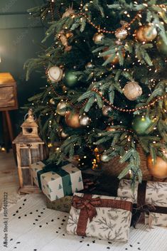 a christmas tree with presents under it