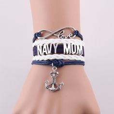 a bracelet with an anchor and the word navy mom on it, sitting on top of a mannequin