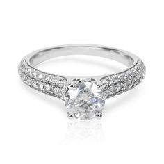 a diamond engagement ring on a white background