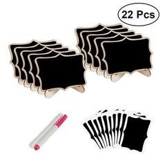 a set of twelve black and white chalkboard magnets next to a marker pen