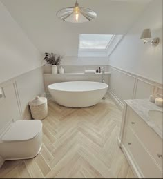 a large white bath tub sitting inside of a bathroom