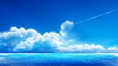 an ocean scene with clouds in the sky