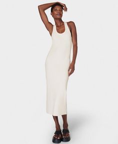 The throw-on midi your wardrobe's been waiting for. A soft, ribbed fabric made with 46% cotton . Slim fit with a flattering stretch and racerback silhouette . Features contrasting binding on the neckline and armholes for a sporty look. Front length: 122cm / 48". Model wears size S and is 178cm/5'10" tall. Style Code: SB9746Colour: Lily White White Women Dresses, Ribbed Tank Dress, Lily White, Running Leggings, Yoga Shop, Sporty Look, Ski Wear, Ribbed Fabric, Yoga Clothes