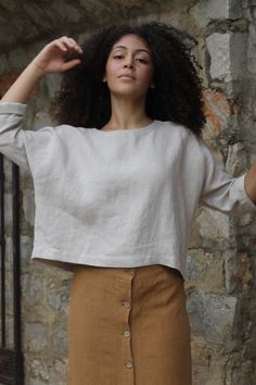 "SIZES Washed linen crop top with long sleeves. This top is perfect to wear with any skirt or pants. It fits very comfortably over the head and has no closures. It is made with high quality washed linen and handmade in Spain. DETAILS Oeko-Tex certified quality guarantee. 100% European linen ( Belarusian )of the best quality of a medium weight (185gr) This linen is washed and softened to have a nice touch. Linen is an ecological and breathable fabric as it is a 100% natural fabric. All our garmen Versatile Cropped Linen Tops, Oversized Long Sleeve Minimalist Tops, Plain Long Sleeve Linen Top, Linen Crew Neck Blouse For Fall, Minimalist Relaxed Fit Summer Tops, Cropped Linen Top For Fall, Versatile Beige Linen Top, Simple Cropped Tops For Spring, Versatile Cropped Tops With Relaxed Fit