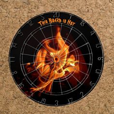 an image of a fire in the middle of a dart board with words on it